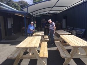 max and Gary putting finishing touches to the four tables for Woonona Bowling Club.
